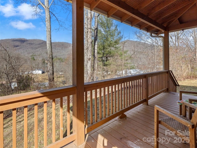 wooden deck featuring a mountain view