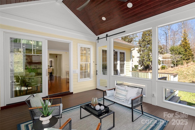 sunroom featuring a wealth of natural light, wood ceiling, and vaulted ceiling