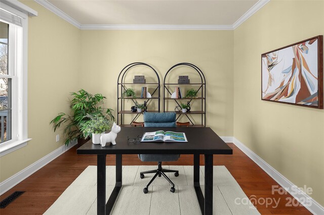 office area with visible vents, baseboards, ornamental molding, and dark wood-style flooring