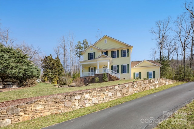 view of front facade with a porch and crawl space