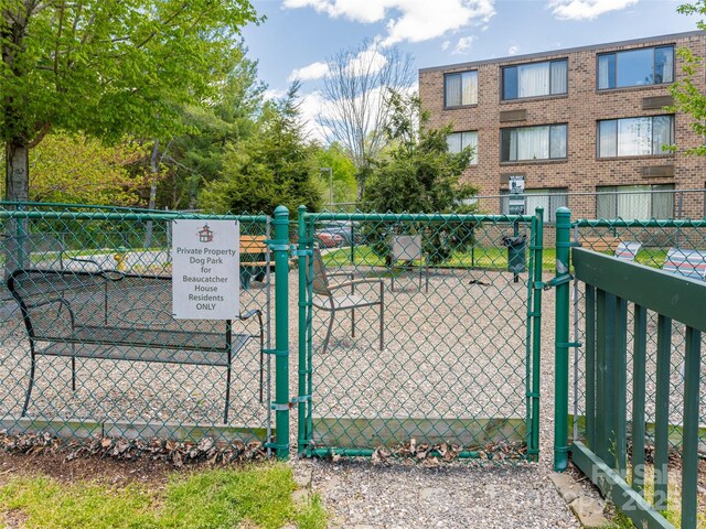 view of gate featuring fence