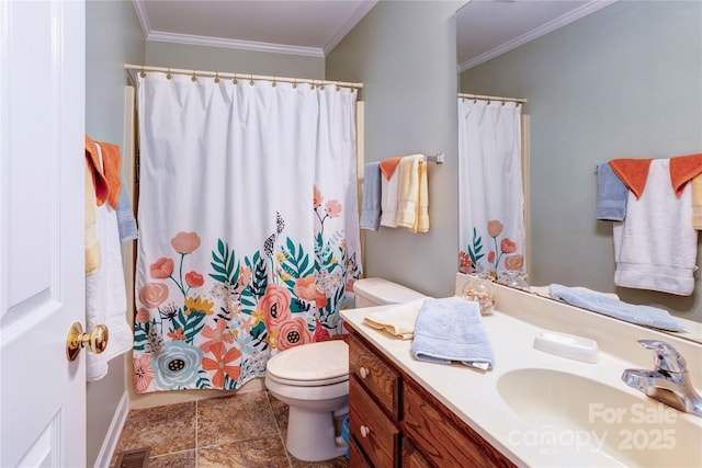 bathroom with ornamental molding, vanity, toilet, and walk in shower