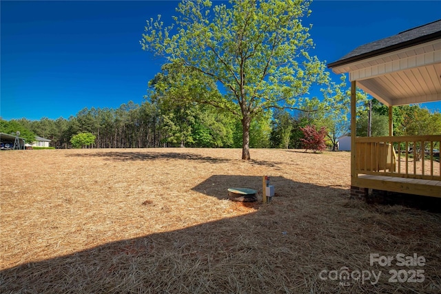 view of yard with a wooden deck