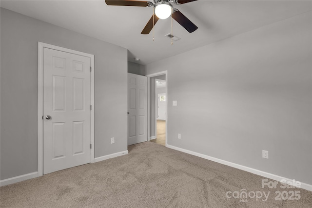 unfurnished bedroom with carpet and ceiling fan