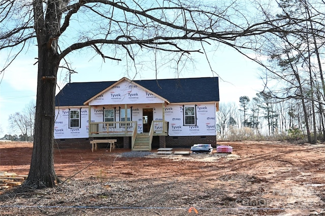 property in mid-construction featuring a porch