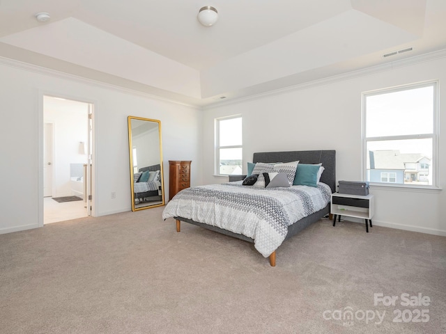 bedroom featuring light carpet, visible vents, baseboards, ornamental molding, and a raised ceiling