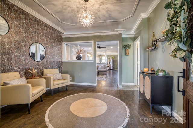 interior space with ornamental molding, ceiling fan with notable chandelier, and dark hardwood / wood-style flooring