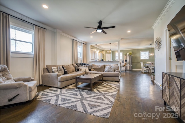 living room with dark wood-type flooring, ceiling fan, and ornamental molding