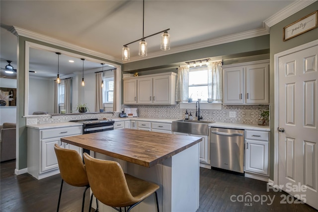 kitchen featuring white cabinetry, dishwasher, and sink