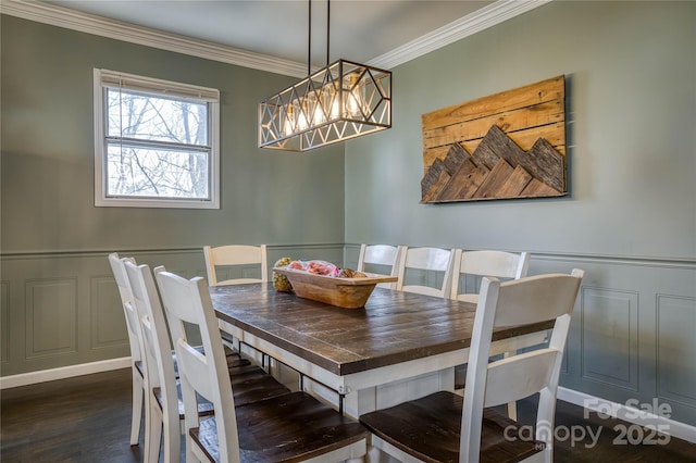 dining space featuring a notable chandelier, crown molding, and dark hardwood / wood-style floors