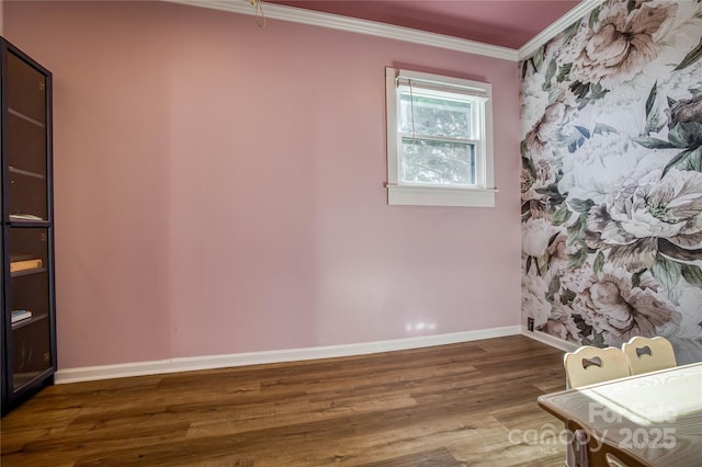 unfurnished room featuring ornamental molding and dark hardwood / wood-style flooring