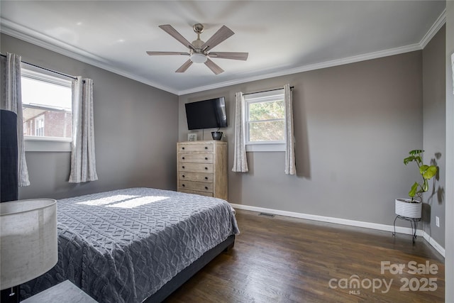 bedroom featuring dark wood-type flooring, ornamental molding, and ceiling fan