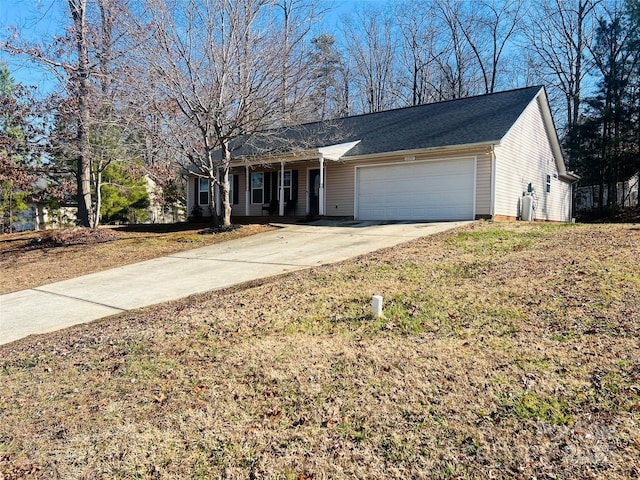 ranch-style home with a garage and a front yard