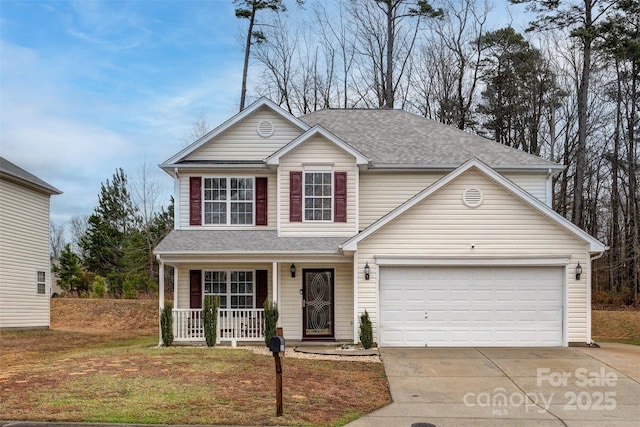 front of property with a garage and covered porch