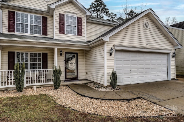 front facade with a porch and a garage