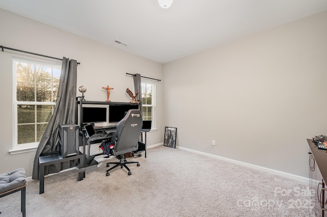 home office with baseboards, visible vents, and carpet