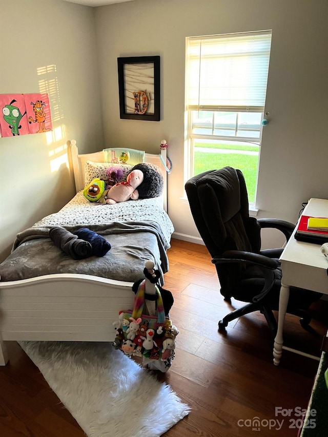 bedroom with wood finished floors