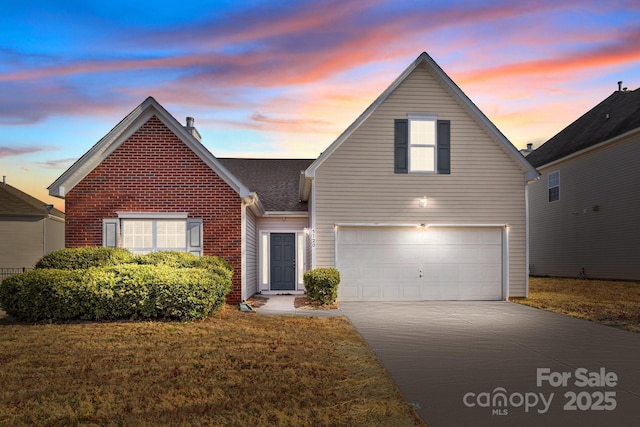 traditional home featuring driveway, a shingled roof, a front lawn, and brick siding