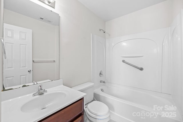 bathroom featuring toilet, visible vents, tub / shower combination, and vanity