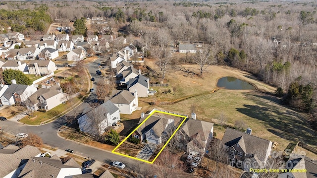 aerial view with a residential view and a water view