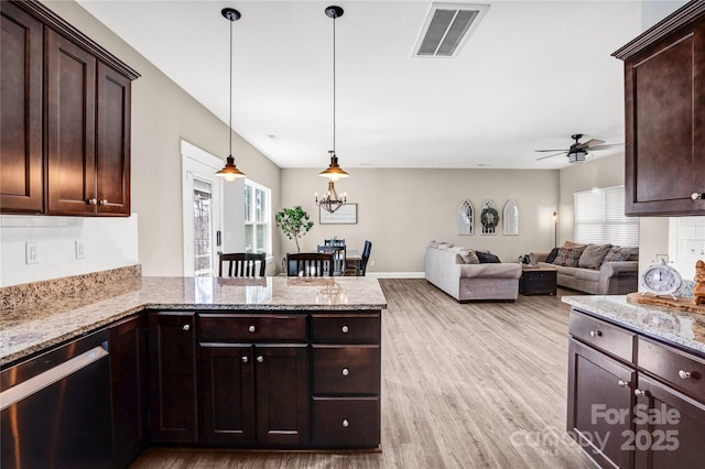 kitchen with plenty of natural light, visible vents, light wood-style flooring, and dishwasher