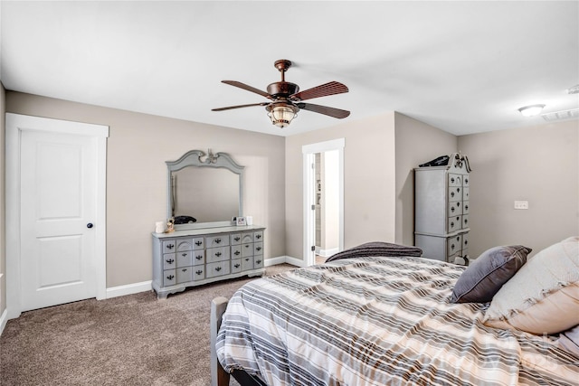 carpeted bedroom featuring ceiling fan, visible vents, and baseboards