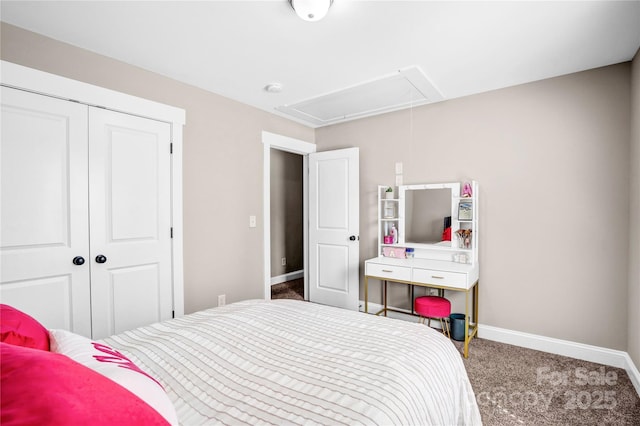 bedroom featuring carpet, attic access, baseboards, and a closet