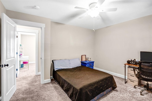 bedroom with a ceiling fan, baseboards, and carpet flooring