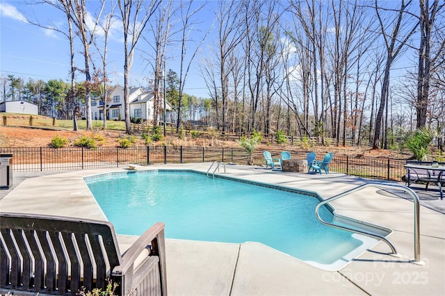 view of pool featuring a fenced in pool, a patio area, and fence