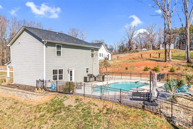 view of swimming pool featuring fence, a fenced in pool, and a patio