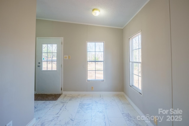 doorway featuring crown molding and a textured ceiling