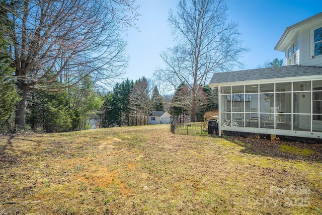 view of yard featuring a sunroom