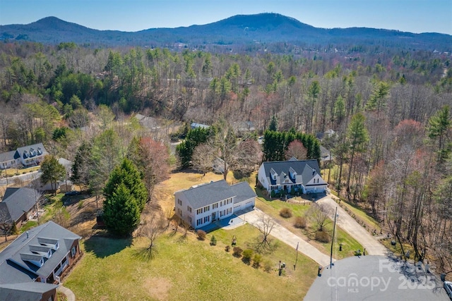 bird's eye view featuring a mountain view and a forest view