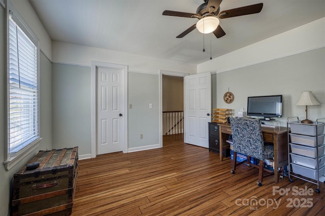 office area featuring baseboards, ceiling fan, and wood finished floors