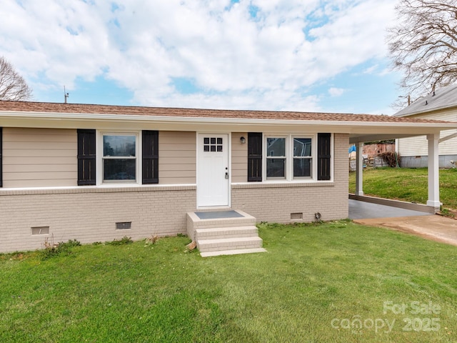 view of front of house with crawl space, brick siding, and a front yard