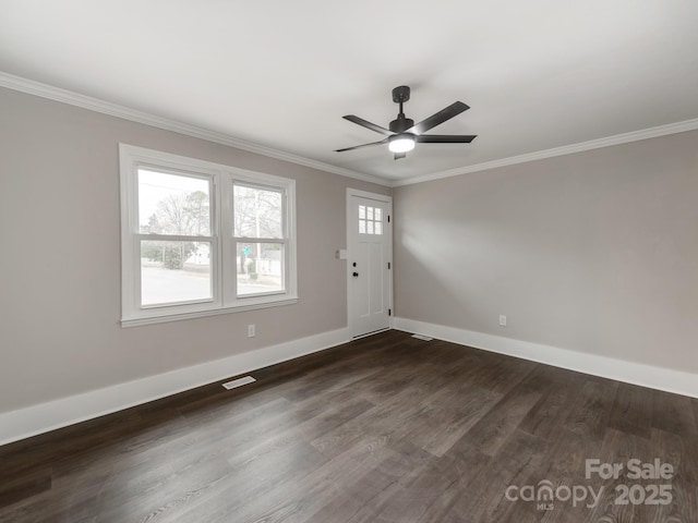 entryway featuring visible vents, a ceiling fan, baseboards, ornamental molding, and dark wood finished floors