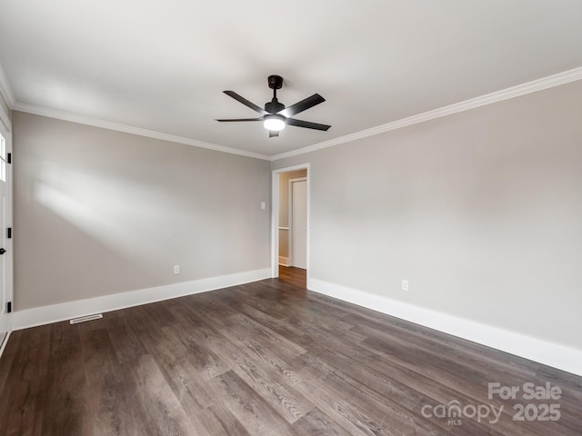 spare room featuring a ceiling fan, crown molding, baseboards, and wood finished floors