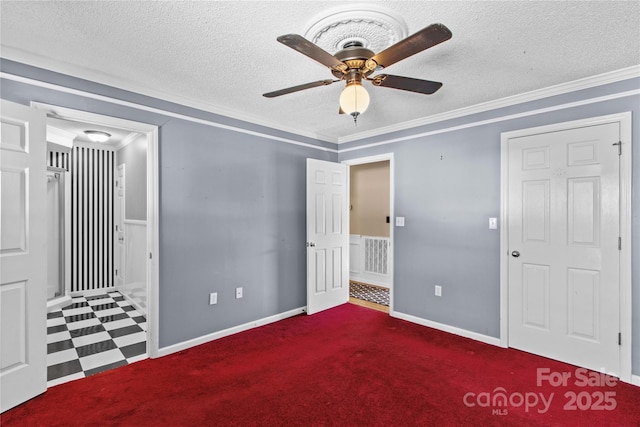 unfurnished bedroom with a textured ceiling, ornamental molding, visible vents, and baseboards