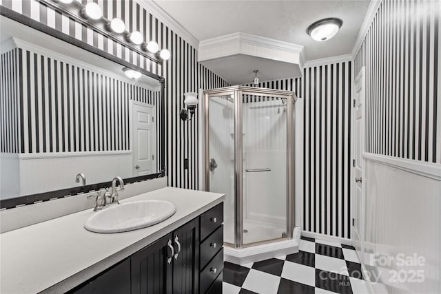 full bath featuring ornamental molding, a stall shower, tile patterned floors, and wallpapered walls