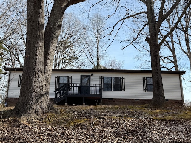 manufactured / mobile home featuring crawl space and a wooden deck