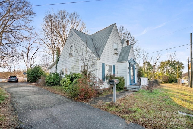 view of property exterior featuring a yard