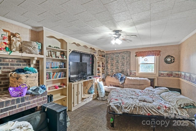 carpeted bedroom with ornamental molding and ceiling fan