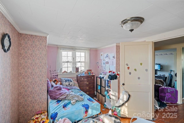 bedroom featuring crown molding and hardwood / wood-style flooring