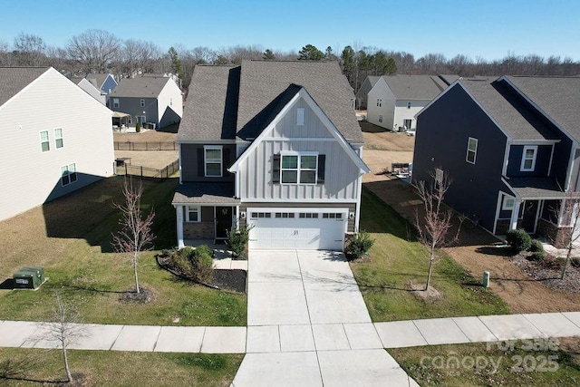 view of front of property with a garage and a front lawn