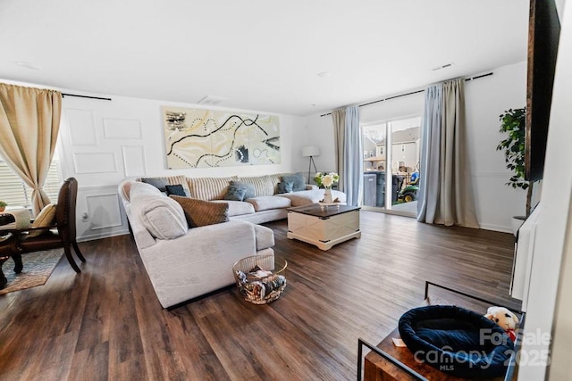 living room featuring dark wood-type flooring