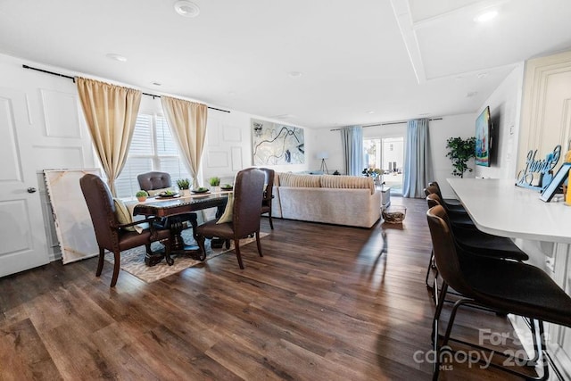 dining area with dark hardwood / wood-style flooring