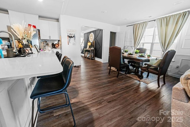 dining area featuring dark hardwood / wood-style flooring