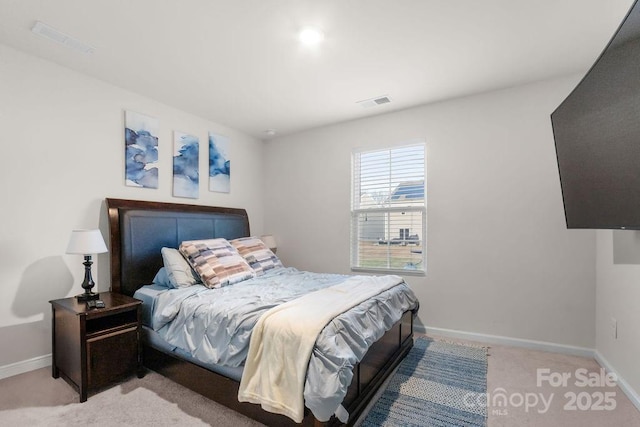 bedroom featuring light colored carpet