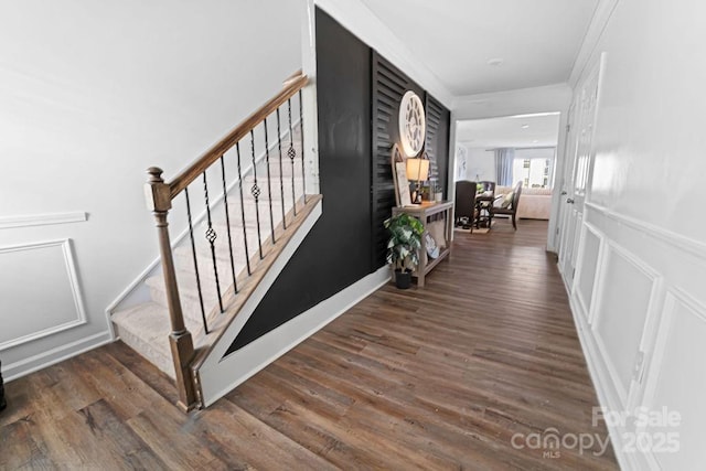 hall with dark hardwood / wood-style flooring