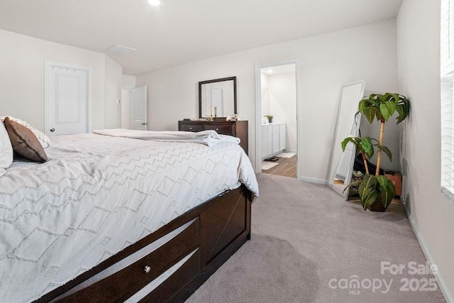 bedroom with light colored carpet